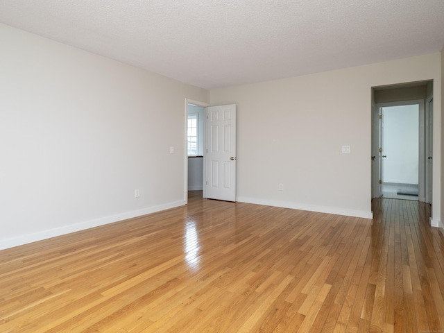 24 Wilton Crst Unit 24, Wilton, CT 06897 - spare room with light wood-style floors and baseboards