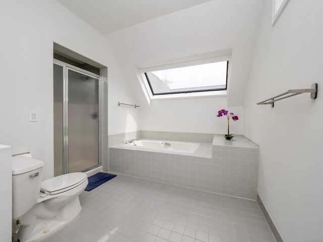 24 Wilton Crst Unit 24, Wilton, CT 06897 - bathroom featuring a skylight, toilet, a shower stall, and tile patterned floors