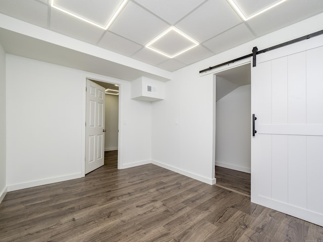 24 Wilton Crst Unit 24, Wilton, CT 06897 - unfurnished bedroom with a barn door, dark wood-style floors, and baseboards