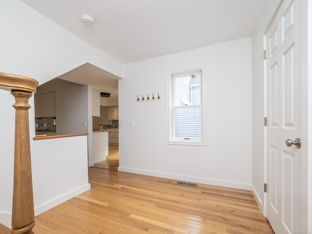 24 Wilton Crst Unit 24, Wilton, CT 06897 - spare room with light wood-style floors, a smoke detector, and baseboards
