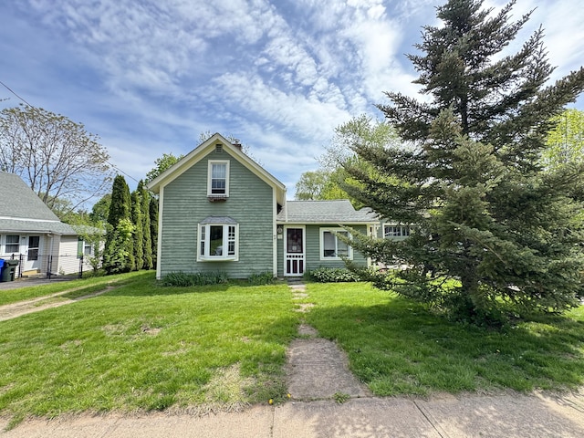 traditional-style house with a front lawn