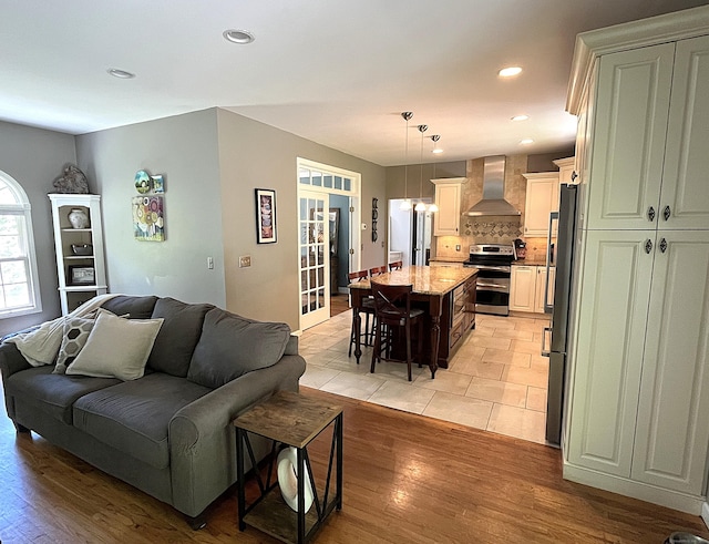 27 Regency Dr, North Haven, CT 06473 - living area with light wood-type flooring and recessed lighting