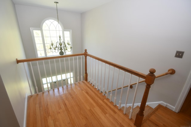 27 Regency Dr, North Haven, CT 06473 - staircase with wood finished floors and a chandelier