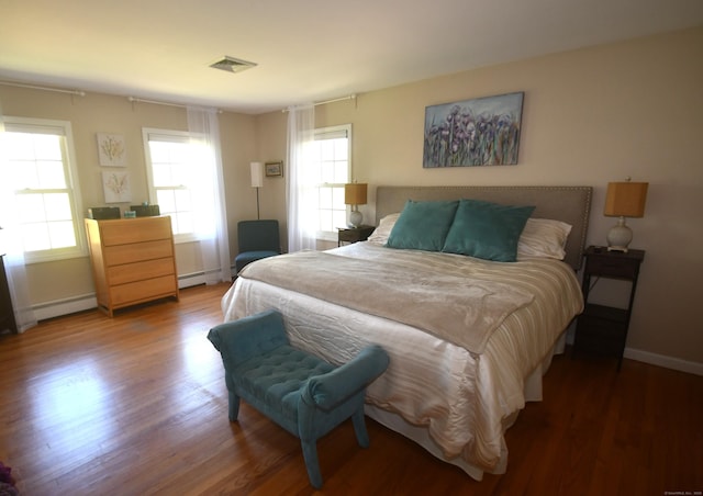 27 Regency Dr, North Haven, CT 06473 - bedroom featuring wood finished floors, baseboards, and baseboard heating