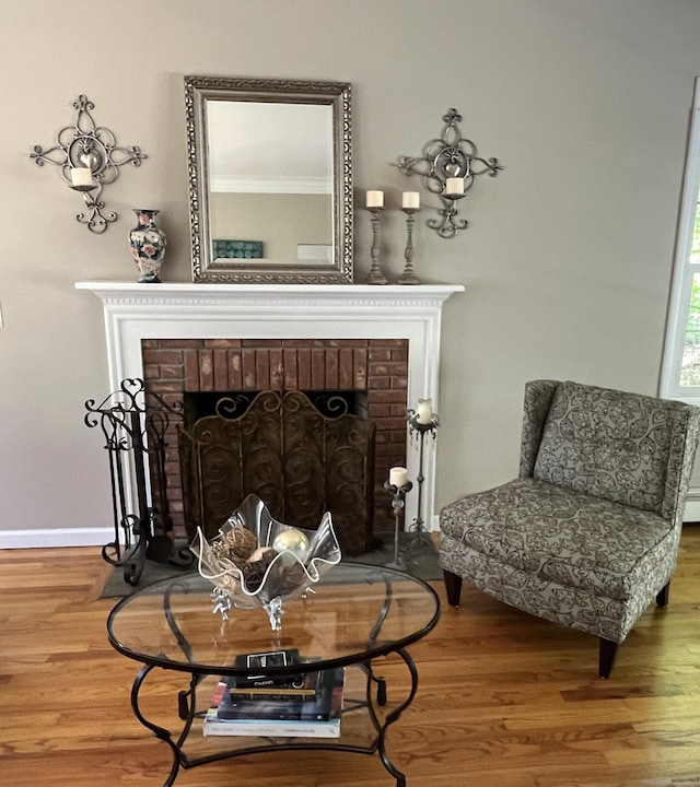 27 Regency Dr, North Haven, CT 06473 - detailed view of a fireplace, wood finished floors, and baseboards