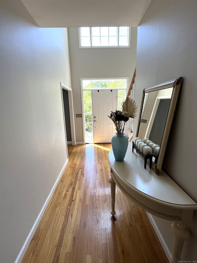 27 Regency Dr, North Haven, CT 06473 - foyer entrance featuring wood finished floors, baseboards, stairs, and a high ceiling
