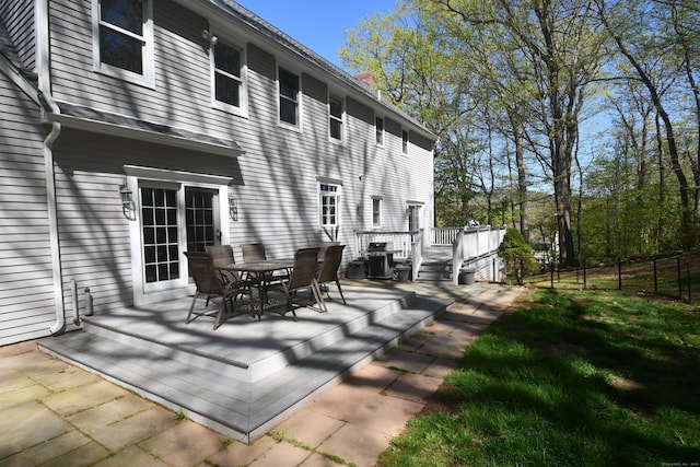 27 Regency Dr, North Haven, CT 06473 - view of patio / terrace with a wooden deck and outdoor dining area