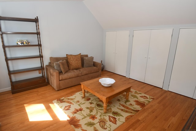 27 Regency Dr, North Haven, CT 06473 - living room featuring light wood-style flooring and vaulted ceiling