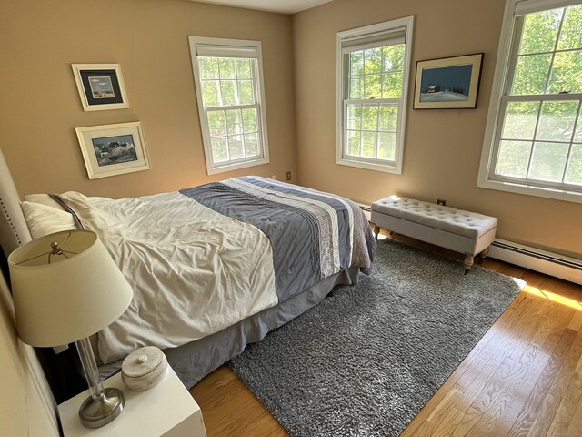 27 Regency Dr, North Haven, CT 06473 - bedroom featuring multiple windows and wood finished floors
