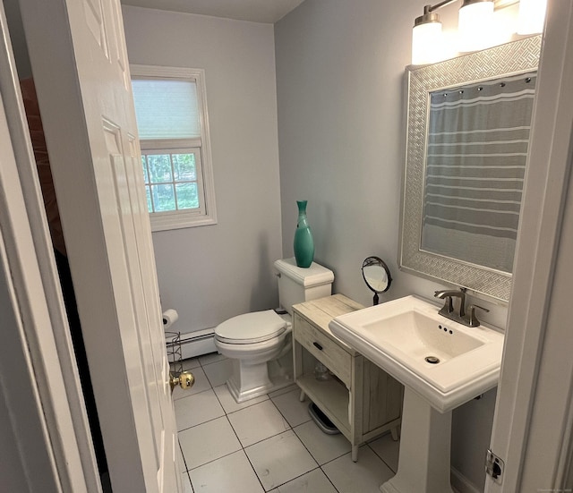 27 Regency Dr, North Haven, CT 06473 - bathroom featuring baseboard heating, toilet, and tile patterned floors
