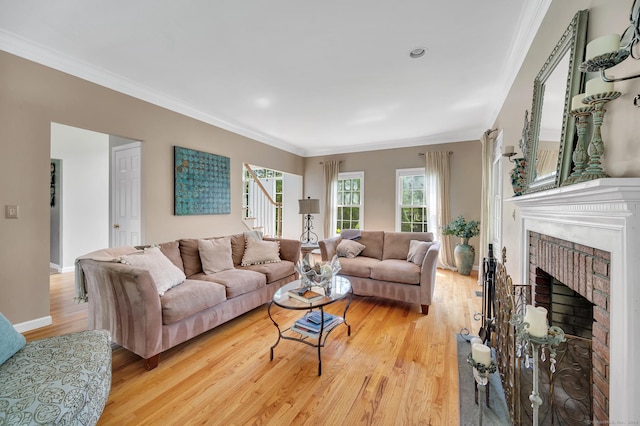 27 Regency Dr, North Haven, CT 06473 - living room with light wood-style floors, ornamental molding, and a brick fireplace