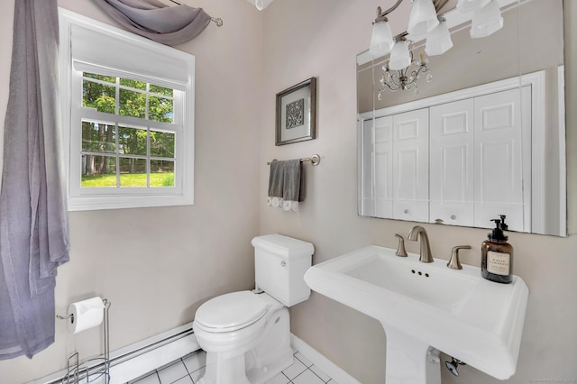27 Regency Dr, North Haven, CT 06473 - bathroom featuring toilet, baseboards, tile patterned floors, and a sink