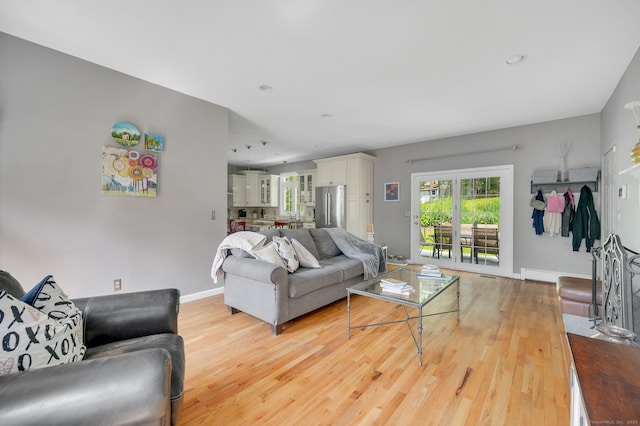 27 Regency Dr, North Haven, CT 06473 - living room with light wood-style flooring and baseboards