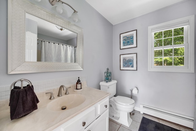 27 Regency Dr, North Haven, CT 06473 - bathroom featuring a baseboard heating unit, vanity, toilet, and tile patterned flooring