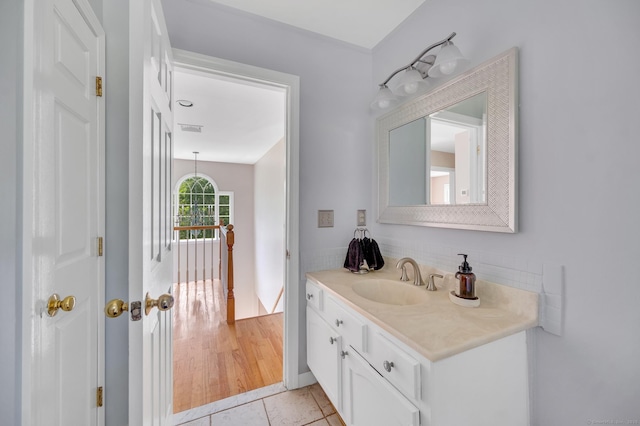 27 Regency Dr, North Haven, CT 06473 - bathroom featuring vanity, backsplash, and tile patterned floors