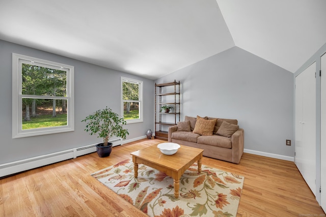 27 Regency Dr, North Haven, CT 06473 - living area featuring vaulted ceiling, healthy amount of natural light, light wood finished floors, a baseboard heating unit, and baseboards