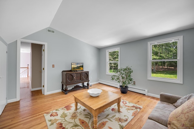 27 Regency Dr, North Haven, CT 06473 - living area featuring lofted ceiling, light wood finished floors, baseboards, and a baseboard heating unit