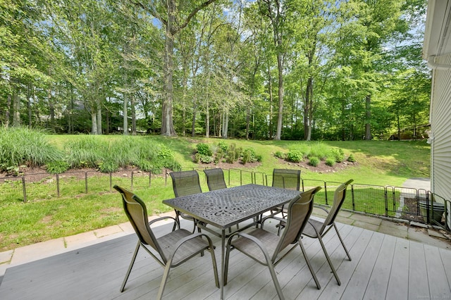 27 Regency Dr, North Haven, CT 06473 - wooden terrace with outdoor dining space, a yard, and view of scattered trees