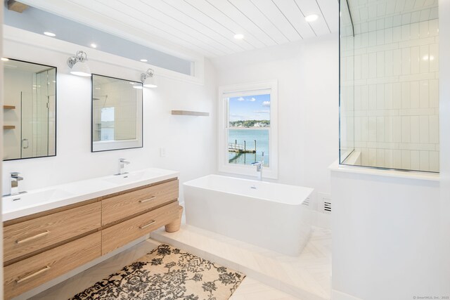 full bathroom featuring a freestanding bath, a walk in shower, double vanity, recessed lighting, and wood ceiling