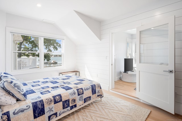 bedroom with light wood finished floors and recessed lighting