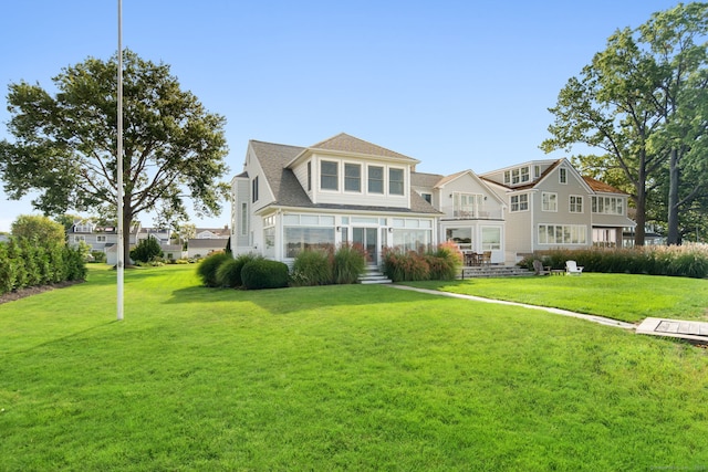 back of house featuring a yard