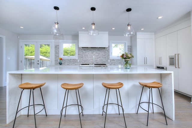 38 Tamarac Rd, Westport, CT 06880 - kitchen with modern cabinets, plenty of natural light, white cabinets, light countertops, and recessed lighting