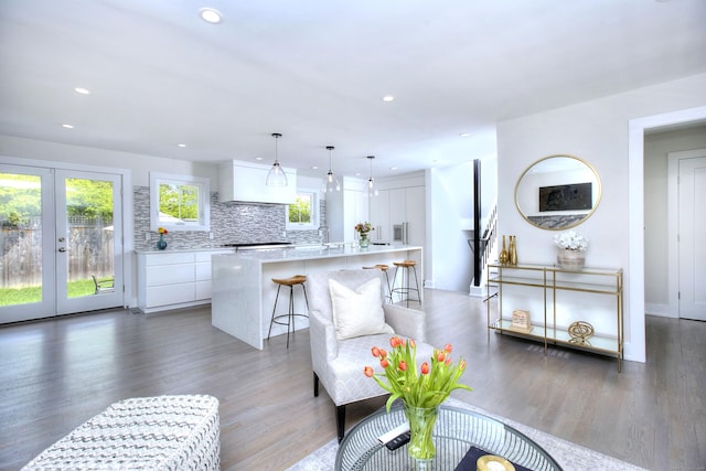 38 Tamarac Rd, Westport, CT 06880 - living room with wood finished floors, french doors, and recessed lighting