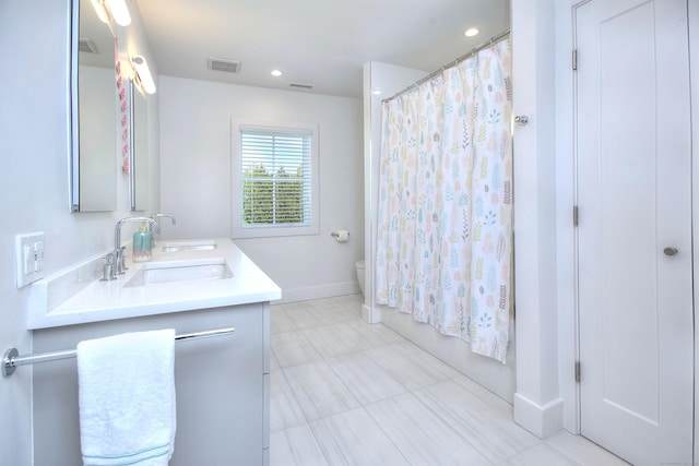 38 Tamarac Rd, Westport, CT 06880 - full bath featuring toilet, double vanity, baseboards, recessed lighting, and shower / tub combo