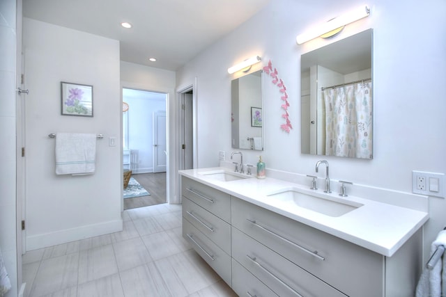 38 Tamarac Rd, Westport, CT 06880 - full bath featuring baseboards, double vanity, and recessed lighting