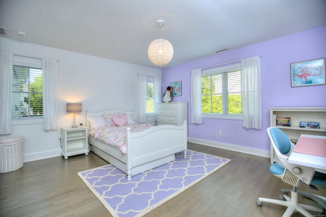 38 Tamarac Rd, Westport, CT 06880 - bedroom with multiple windows, wood finished floors, and a desk