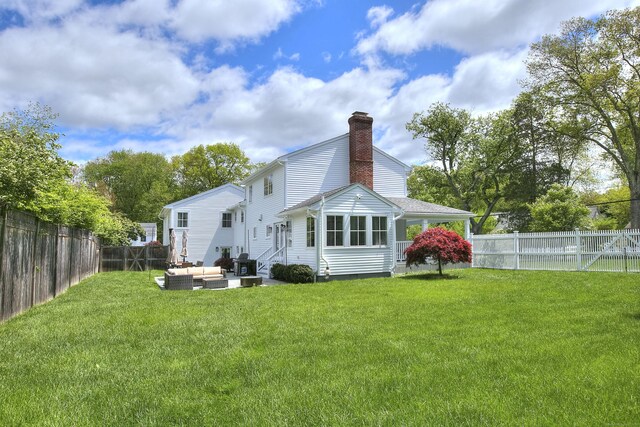 38 Tamarac Rd, Westport, CT 06880 - rear view of house featuring outdoor lounge area, a chimney, and entry steps