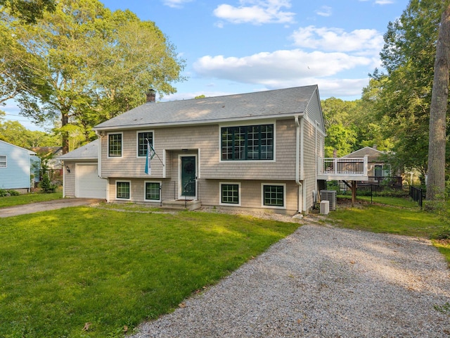 11 Osprey Ln, East Lyme, CT 06357 - raised ranch with central AC, asphalt driveway, a chimney, a shingled roof, and an attached garage