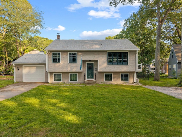 11 Osprey Ln, East Lyme, CT 06357 - bi-level home featuring driveway, entry steps, a chimney, and a front lawn