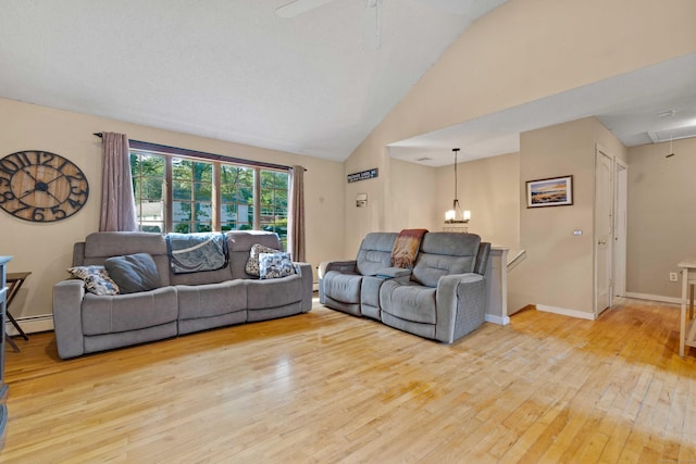 11 Osprey Ln, East Lyme, CT 06357 - living area with attic access, a baseboard radiator, light wood-type flooring, high vaulted ceiling, and ceiling fan