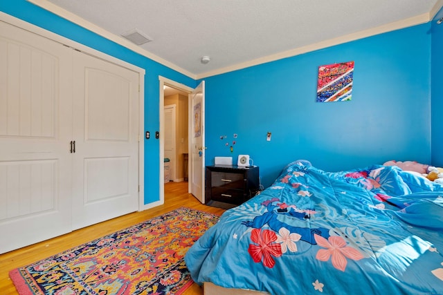 11 Osprey Ln, East Lyme, CT 06357 - bedroom featuring wood finished floors and a closet