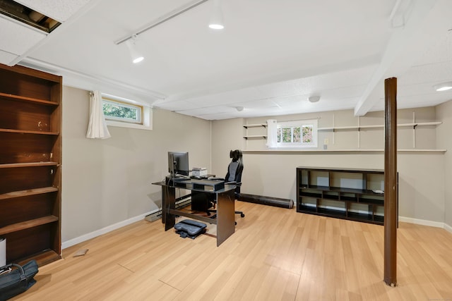 home office featuring baseboards, wood finished floors, and track lighting