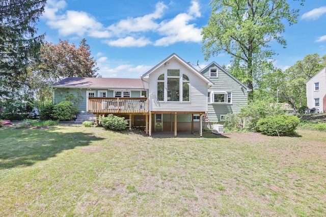 back of house featuring a deck, a yard, and central AC unit