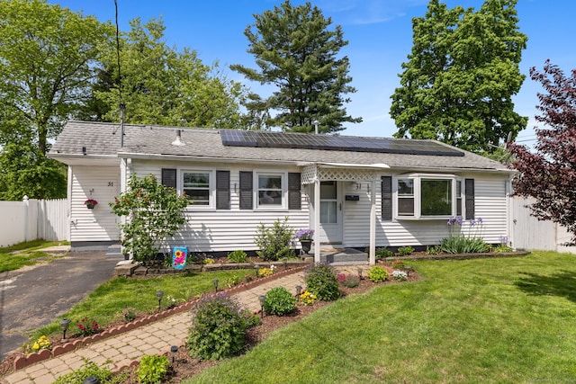 31 Scott St, East Hartford, CT 06118 - view of front of home featuring roof mounted solar panels and roof with shingles