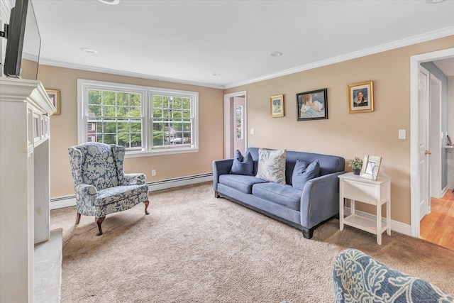 carpeted living room featuring a baseboard heating unit, ornamental molding, and baseboards