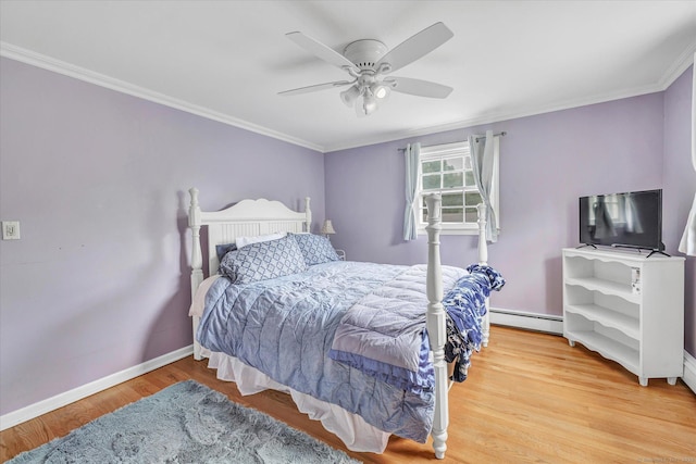 bedroom with a baseboard radiator, crown molding, baseboards, light wood-style floors, and ceiling fan
