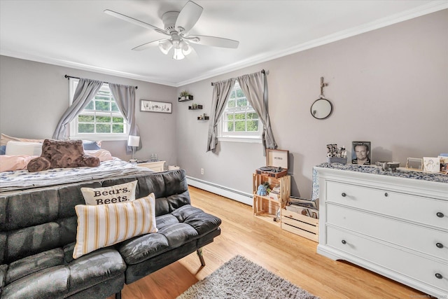 bedroom with a baseboard heating unit, multiple windows, ornamental molding, and light wood finished floors