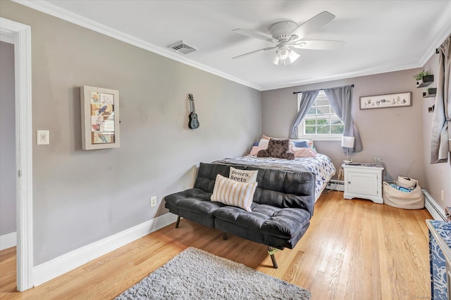 bedroom with wood finished floors, a baseboard radiator, crown molding, baseboards, and ceiling fan