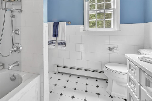 bathroom featuring tile walls, a baseboard radiator, toilet, vanity, and tub / shower combination