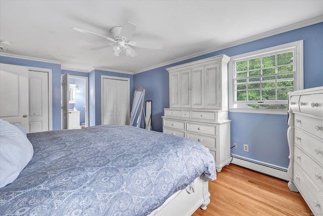 bedroom with a baseboard radiator, light wood-type flooring, ornamental molding, a ceiling fan, and ensuite bath