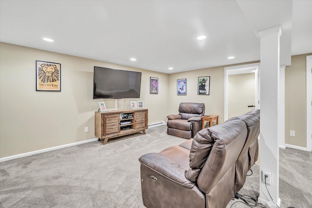 carpeted living area with recessed lighting and baseboards