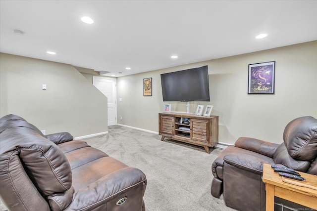 carpeted living area with recessed lighting and baseboards