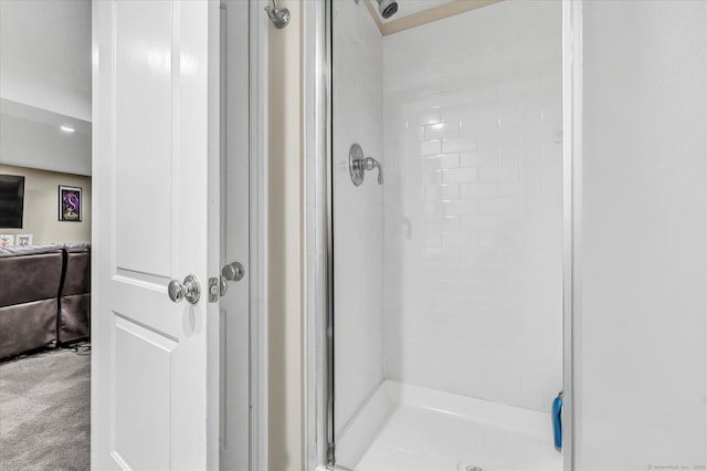 bathroom with a shower stall
