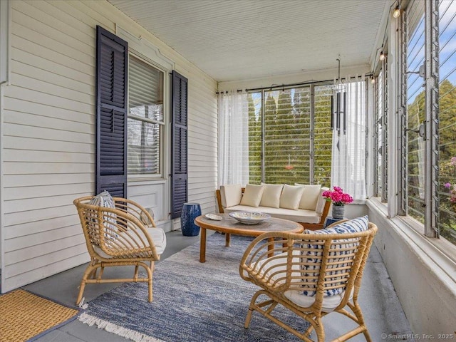 571 Pond Point Ave, Milford, CT 06460 - sunroom / solarium featuring concrete flooring, wood walls, and outdoor lounge area