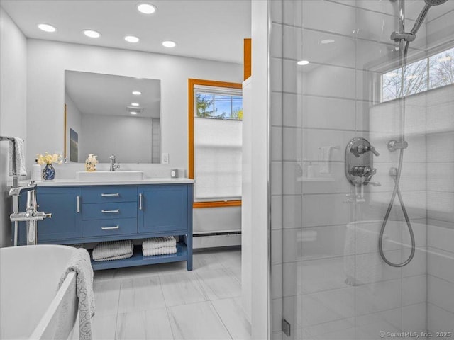 571 Pond Point Ave, Milford, CT 06460 - full bathroom with a shower stall, recessed lighting, vanity, and a soaking tub