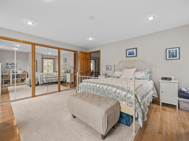 571 Pond Point Ave, Milford, CT 06460 - bedroom with hardwood / wood-style floors, recessed lighting, and multiple closets